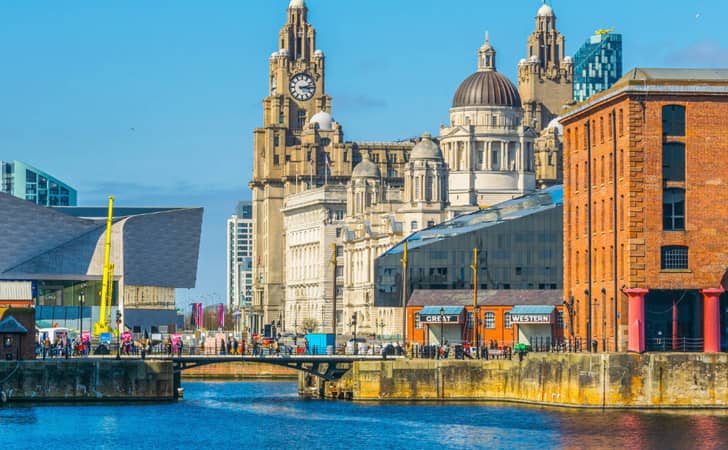 View from the Royal Albert Dock in Liverpool on a sunny day looking towards the Liver Buildings.