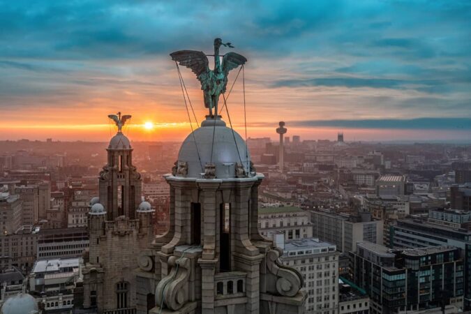 Aerial view of Liverpool with the Liver Birds in the foreground.